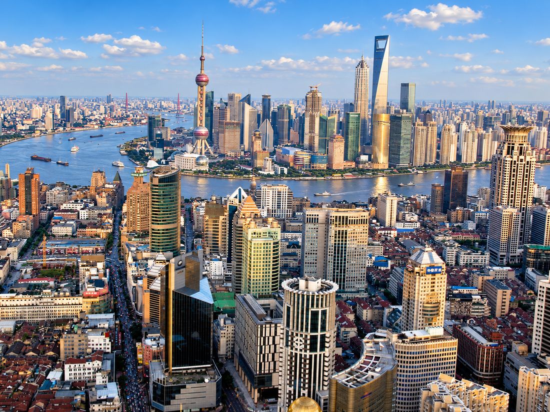 Shanghai from above on a sunny day, the Huangpu River and the Pudong skyline beyond